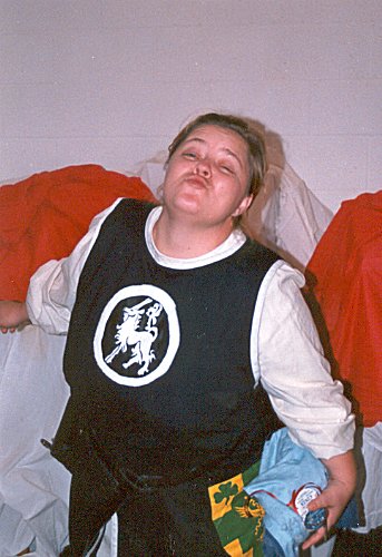 THLady Aislinn Chaomhanach mugging at Hearth & Home Collegium in November A.S. XXXVI (2001)