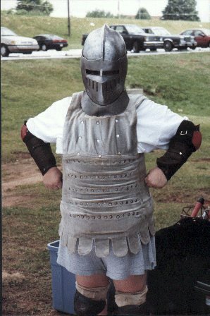 A mysterious houshold member in really old loaner armor at a Pine Log Park fighter practice in the summer of A.S. XXXII (1998)