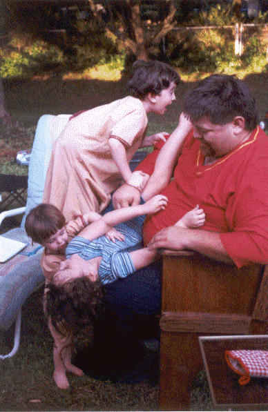 Lord Etienne Dubois as a jungle gym at a household gather in July A.S. XXXVI (2001)
